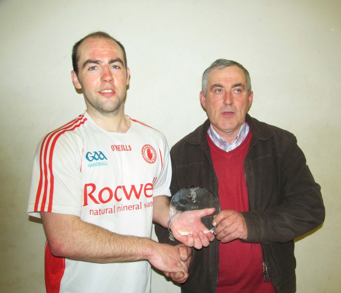Barry Devlin, mens b winner, receives his trophy from Ulster chairman Eugene Maguire